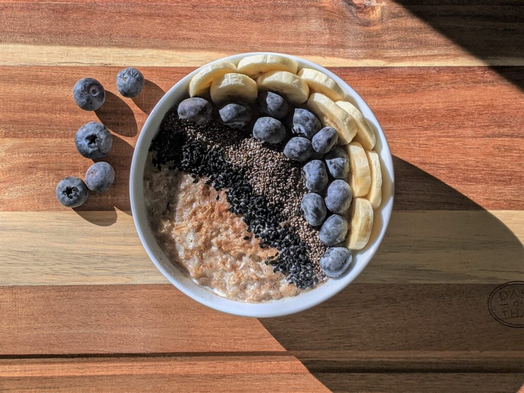 brown and black beans in white ceramic bowl