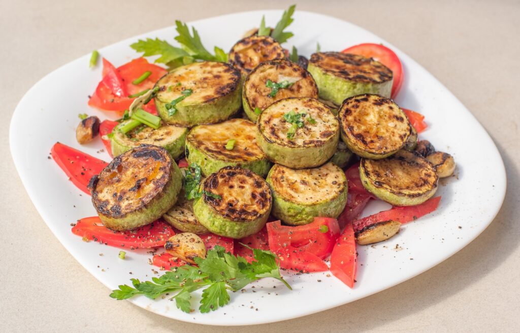 a plate of grilled vegetables on a table